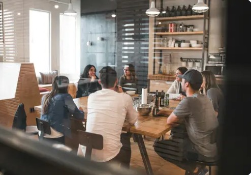 The Exponent Solutions team working together around a table